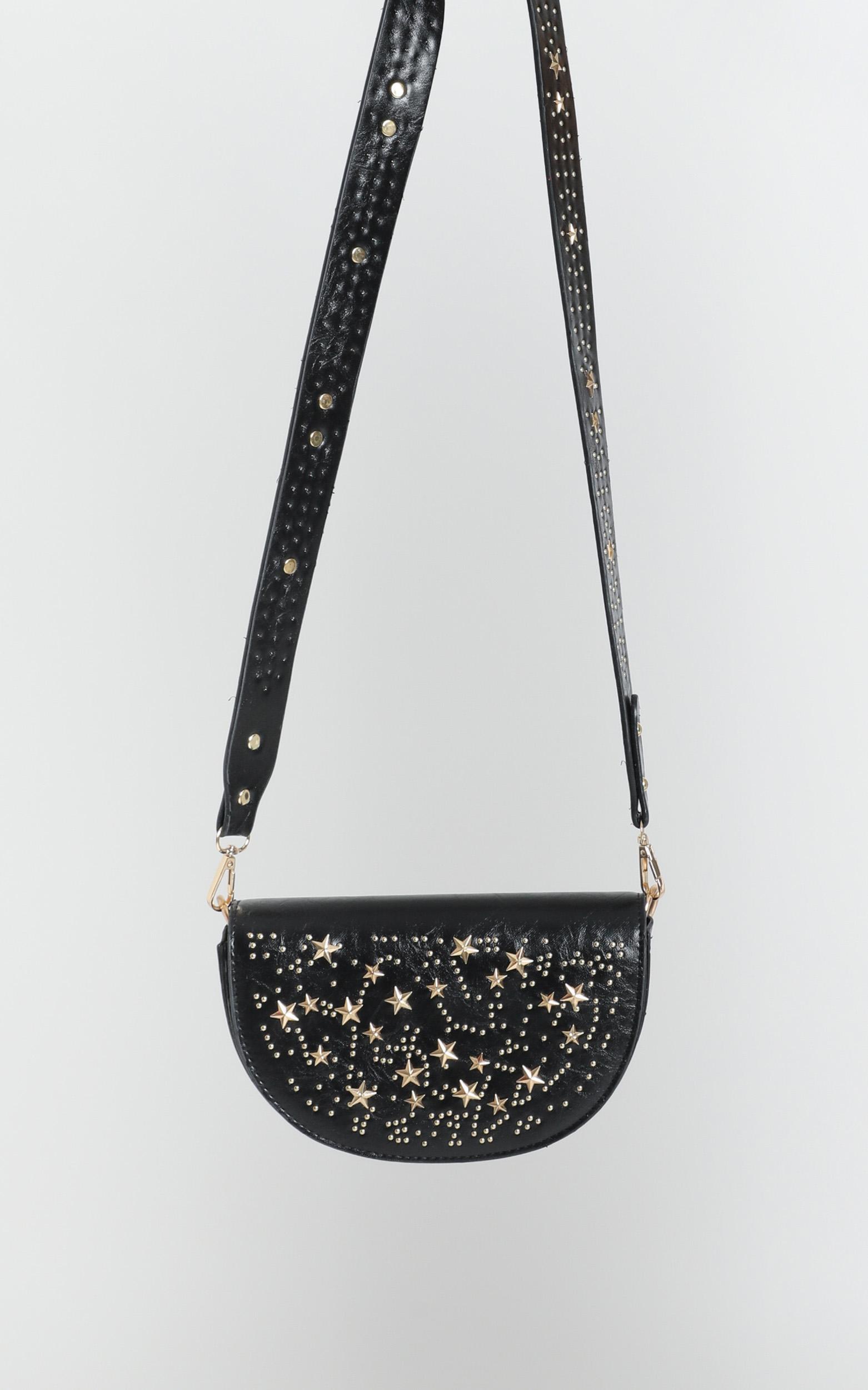 black and gold sling bag